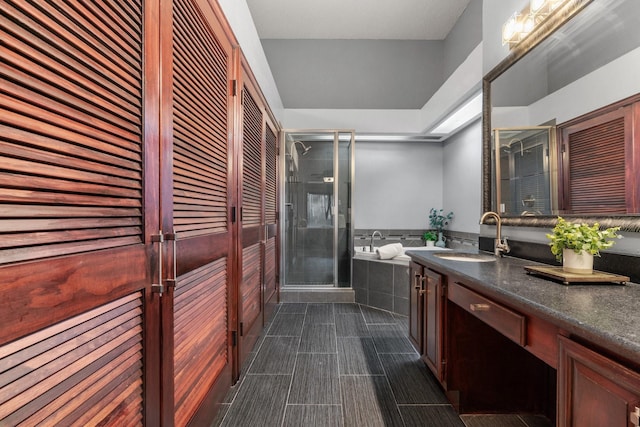 bathroom with vanity, a closet, and a shower stall