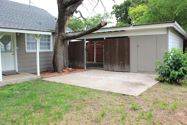 view of outdoor structure featuring fence