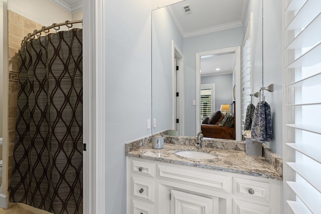 bathroom featuring crown molding, vanity, ensuite bath, and visible vents