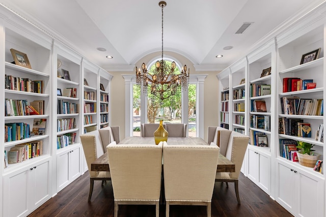 dining space with crown molding, visible vents, a chandelier, vaulted ceiling, and dark wood-style floors
