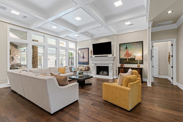 living room with baseboards, a fireplace with raised hearth, dark wood-style flooring, and beamed ceiling