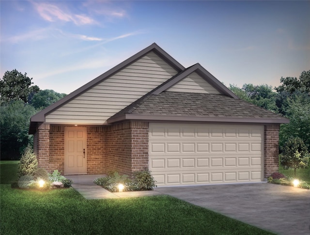 view of front facade with a garage, driveway, roof with shingles, and brick siding