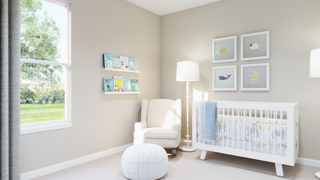bedroom with baseboards and a nursery area
