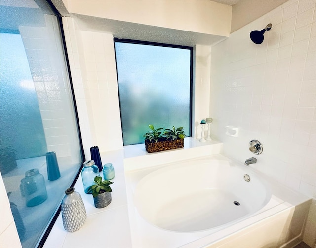 full bathroom with a bath