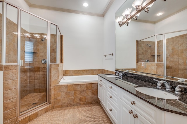 bathroom with a sink, ornamental molding, a shower stall, and a bath