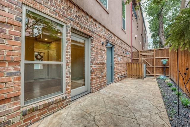view of patio featuring fence