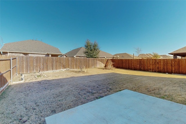 view of yard featuring a fenced backyard and a patio area