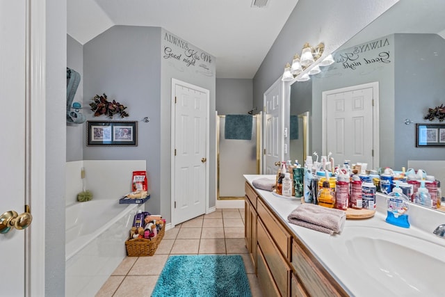 740 Bluebonnet Dr, Stephenville, TX 76401 - full bath featuring a garden tub, tile patterned flooring, double vanity, visible vents, and a sink
