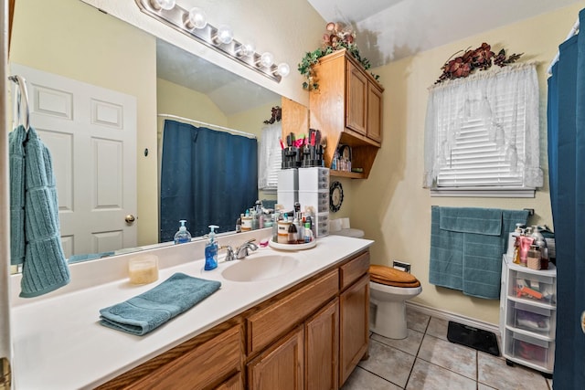 740 Bluebonnet Dr, Stephenville, TX 76401 - bathroom featuring tile patterned floors, vanity, toilet, and curtained shower