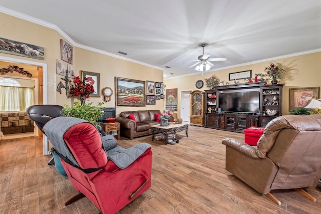 740 Bluebonnet Dr, Stephenville, TX 76401 - living area with visible vents, a ceiling fan, crown molding, and wood finished floors