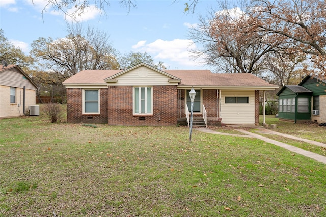 view of front of house featuring cooling unit, a front yard, crawl space, and brick siding