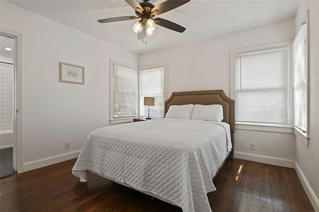 bedroom featuring baseboards, ceiling fan, multiple windows, and hardwood / wood-style flooring