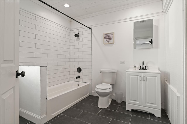bathroom with tile patterned floors, vanity, toilet, ornamental molding, and tub / shower combination