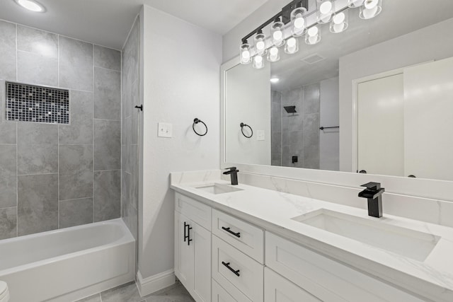 1308 Wheatfield Dr, Mesquite, TX 75149 - full bath featuring a sink, baseboards, tiled shower / bath combo, and double vanity
