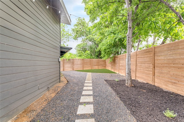 view of yard with a fenced backyard