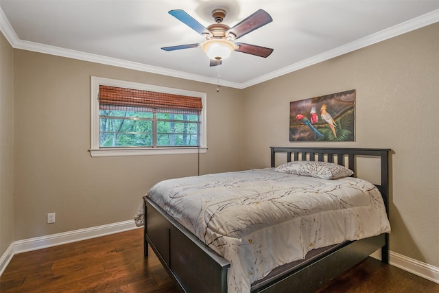 bedroom with baseboards, ornamental molding, ceiling fan, and wood finished floors