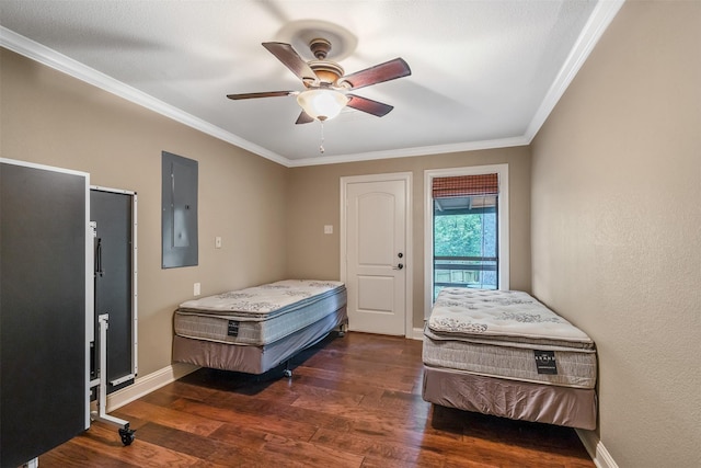bedroom with crown molding, ceiling fan, baseboards, wood finished floors, and electric panel