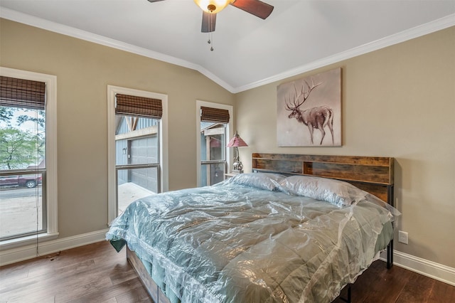 bedroom with crown molding, wood finished floors, baseboards, ceiling fan, and vaulted ceiling