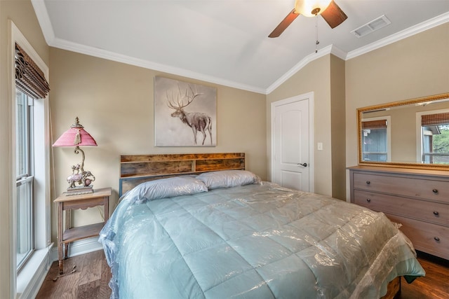 bedroom with visible vents, ornamental molding, and wood finished floors