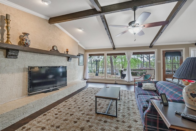 living area featuring ceiling fan, a high end fireplace, wood finished floors, lofted ceiling with beams, and a textured wall