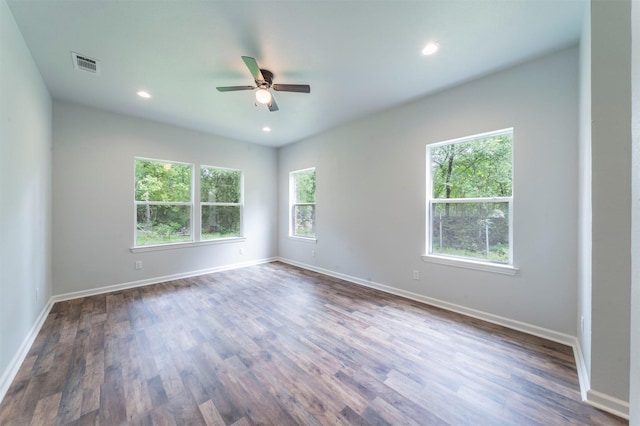 unfurnished room with visible vents, baseboards, dark wood-style floors, recessed lighting, and a ceiling fan