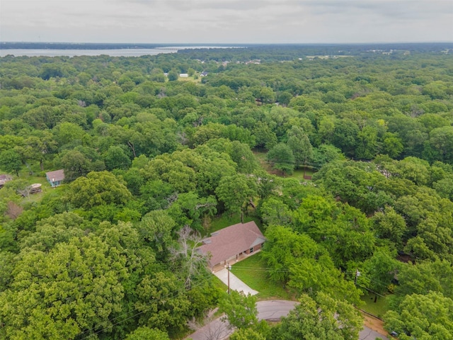 birds eye view of property with a wooded view