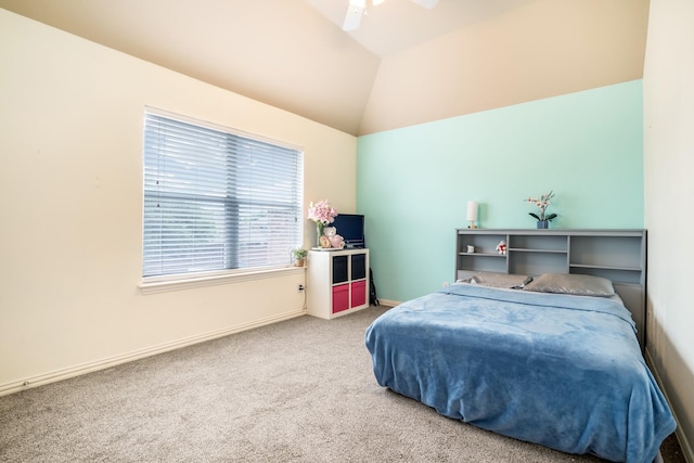 carpeted bedroom with a ceiling fan, baseboards, and vaulted ceiling