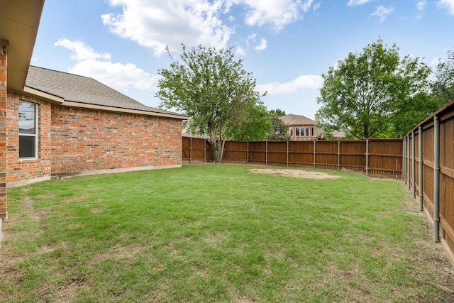 view of yard featuring a fenced backyard