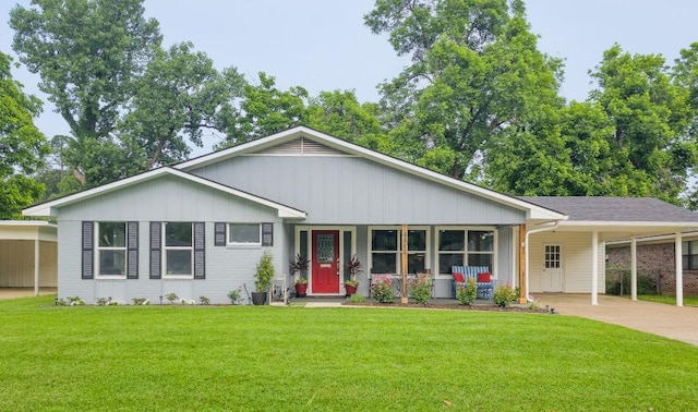 4512 Orchid St, Shreveport, LA 71105 - ranch-style house with driveway, a front yard, an attached carport, and board and batten siding