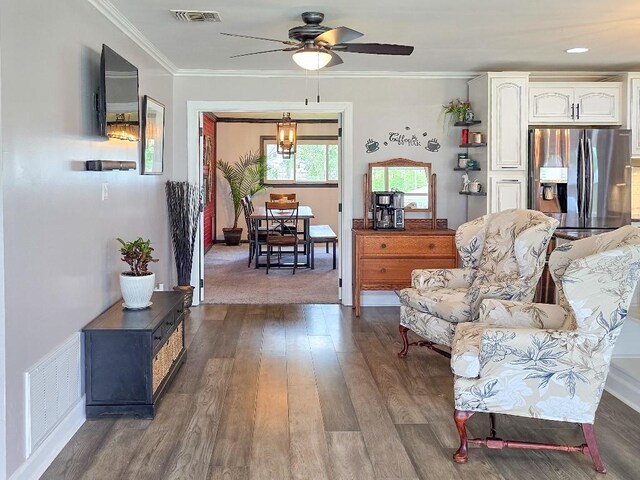 4512 Orchid St, Shreveport, LA 71105 - living room with wood finished floors, a ceiling fan, and crown molding