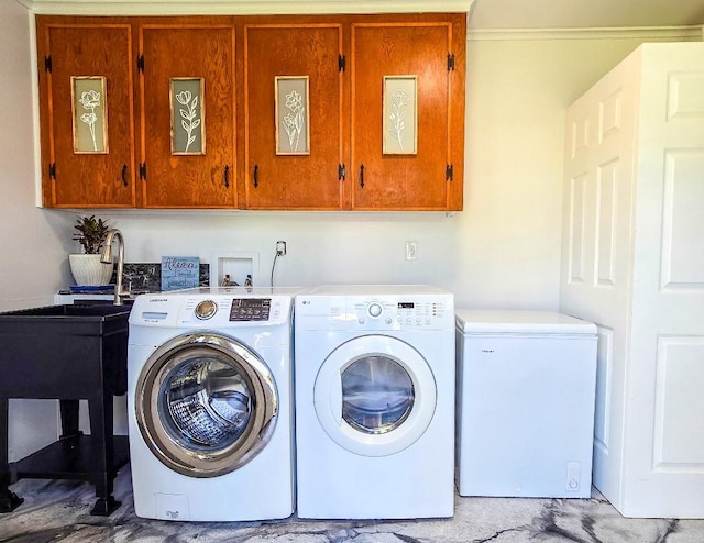 4512 Orchid St, Shreveport, LA 71105 - clothes washing area featuring cabinet space and washing machine and dryer