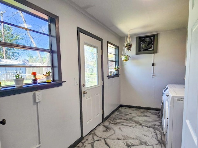 4512 Orchid St, Shreveport, LA 71105 - washroom with baseboards, separate washer and dryer, light marble finish flooring, and crown molding