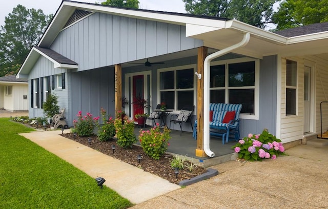 4512 Orchid St, Shreveport, LA 71105 - view of front of home with a porch, board and batten siding, ceiling fan, and a front lawn