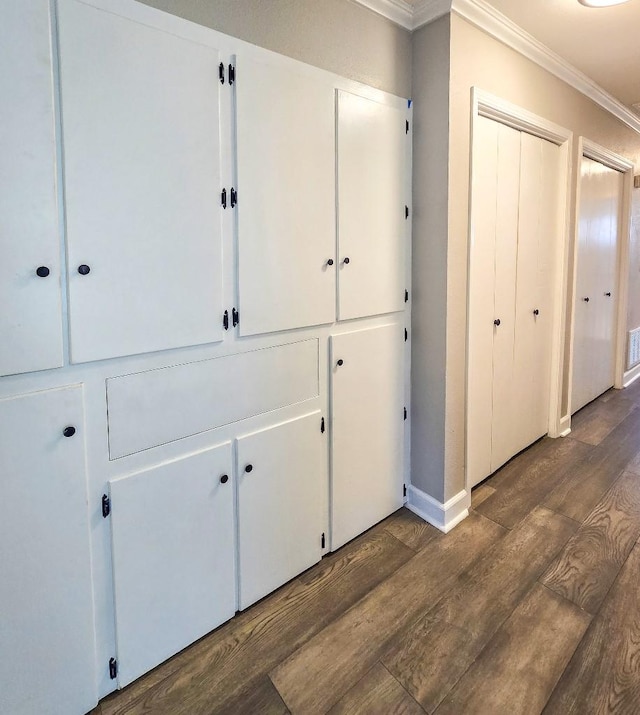4512 Orchid St, Shreveport, LA 71105 - corridor with crown molding, dark wood-style flooring, and baseboards
