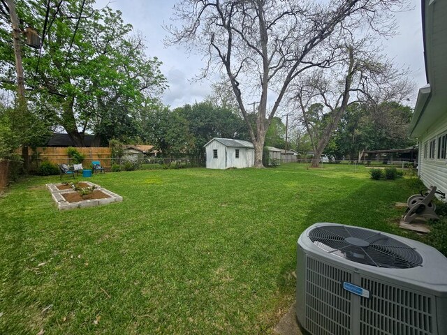 4512 Orchid St, Shreveport, LA 71105 - view of yard with central AC unit, an outdoor structure, and a shed