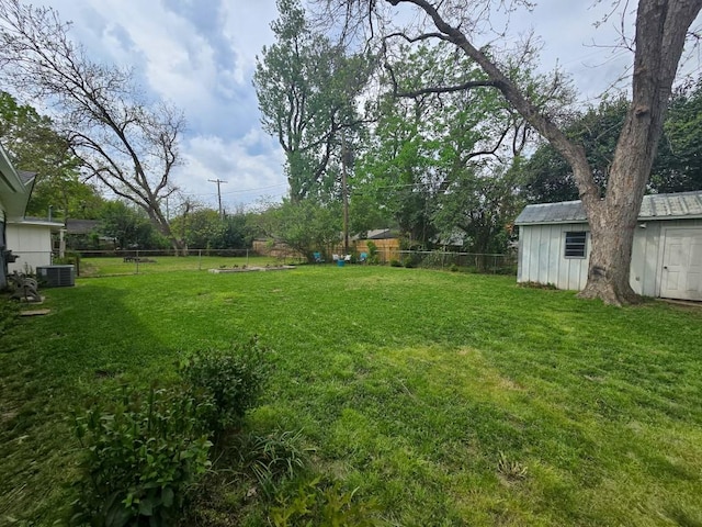 4512 Orchid St, Shreveport, LA 71105 - view of yard featuring an outbuilding, a storage shed, and central air condition unit