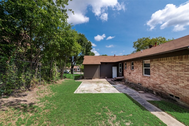 view of yard with a patio and fence