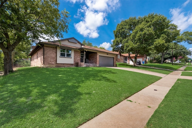 ranch-style house featuring brick siding, a front lawn, an attached garage, and driveway