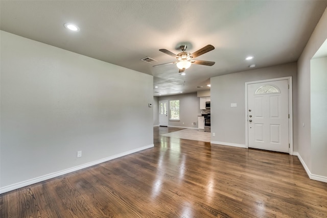 unfurnished living room featuring recessed lighting, ceiling fan, visible vents, and baseboards