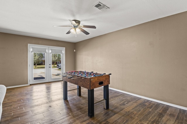 game room featuring ceiling fan, french doors, baseboards, visible vents, and dark wood-style floors