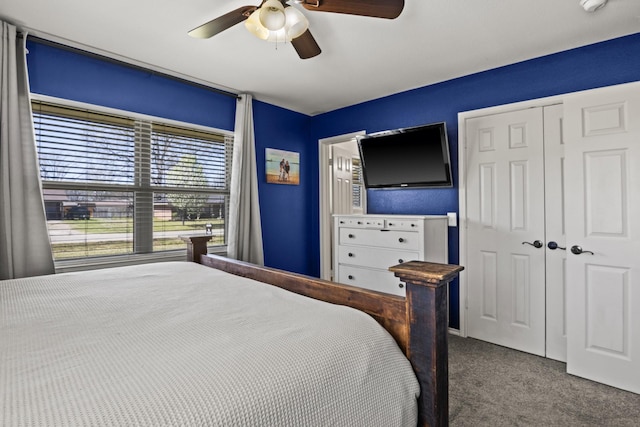 carpeted bedroom with a closet and a ceiling fan