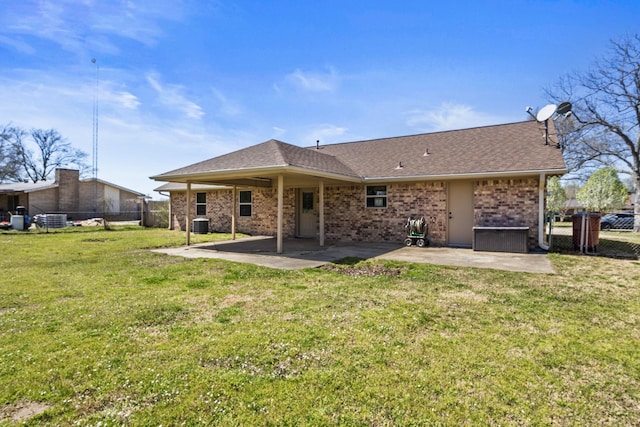 back of property featuring a patio area, fence, and a yard