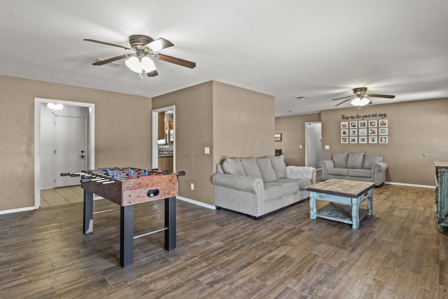 game room featuring a ceiling fan, baseboards, and wood finished floors