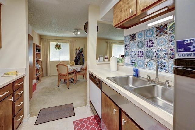 4405 Tophill Ln, Irving, TX 75038 - kitchen featuring plenty of natural light, a sink, white dishwasher, and light countertops