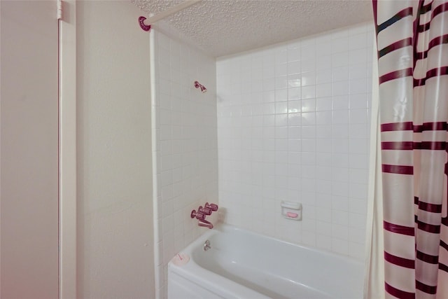 4405 Tophill Ln, Irving, TX 75038 - full bathroom featuring a textured ceiling and shower / bathtub combination with curtain