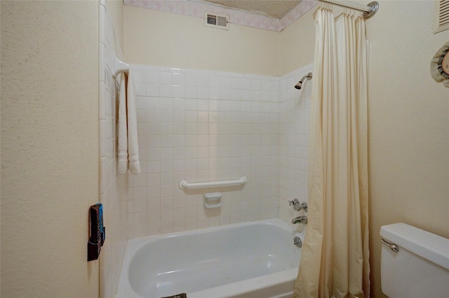 4405 Tophill Ln, Irving, TX 75038 - full bathroom with toilet, visible vents, and shower / tub combo