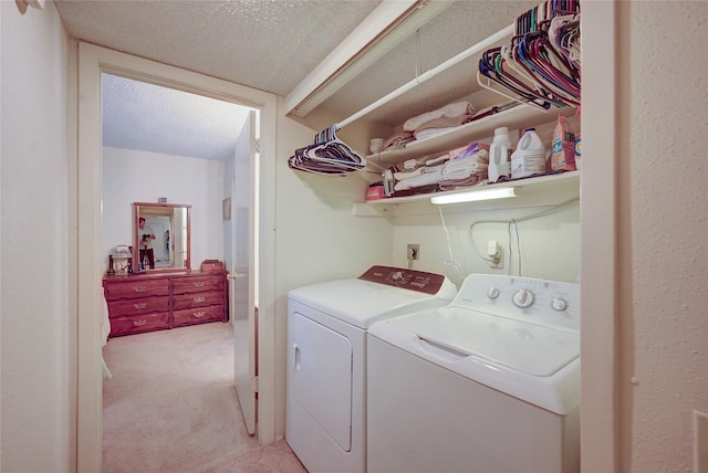 4405 Tophill Ln, Irving, TX 75038 - laundry room featuring laundry area, a textured ceiling, washing machine and dryer, and light carpet