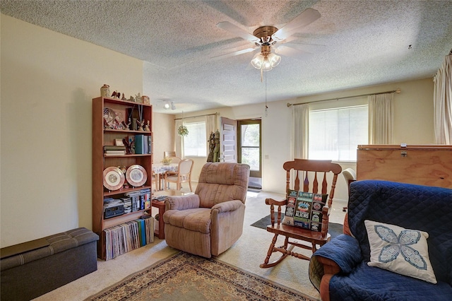4405 Tophill Ln, Irving, TX 75038 - sitting room with a ceiling fan, a textured ceiling, and carpet