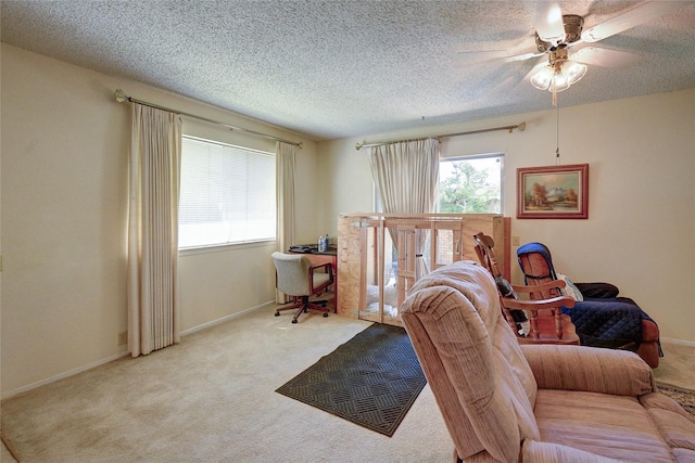 4405 Tophill Ln, Irving, TX 75038 - living room featuring baseboards, a ceiling fan, carpet flooring, and a textured ceiling