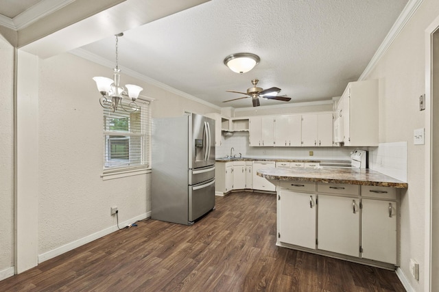 kitchen featuring a peninsula, crown molding, dark wood-style flooring, and white appliances